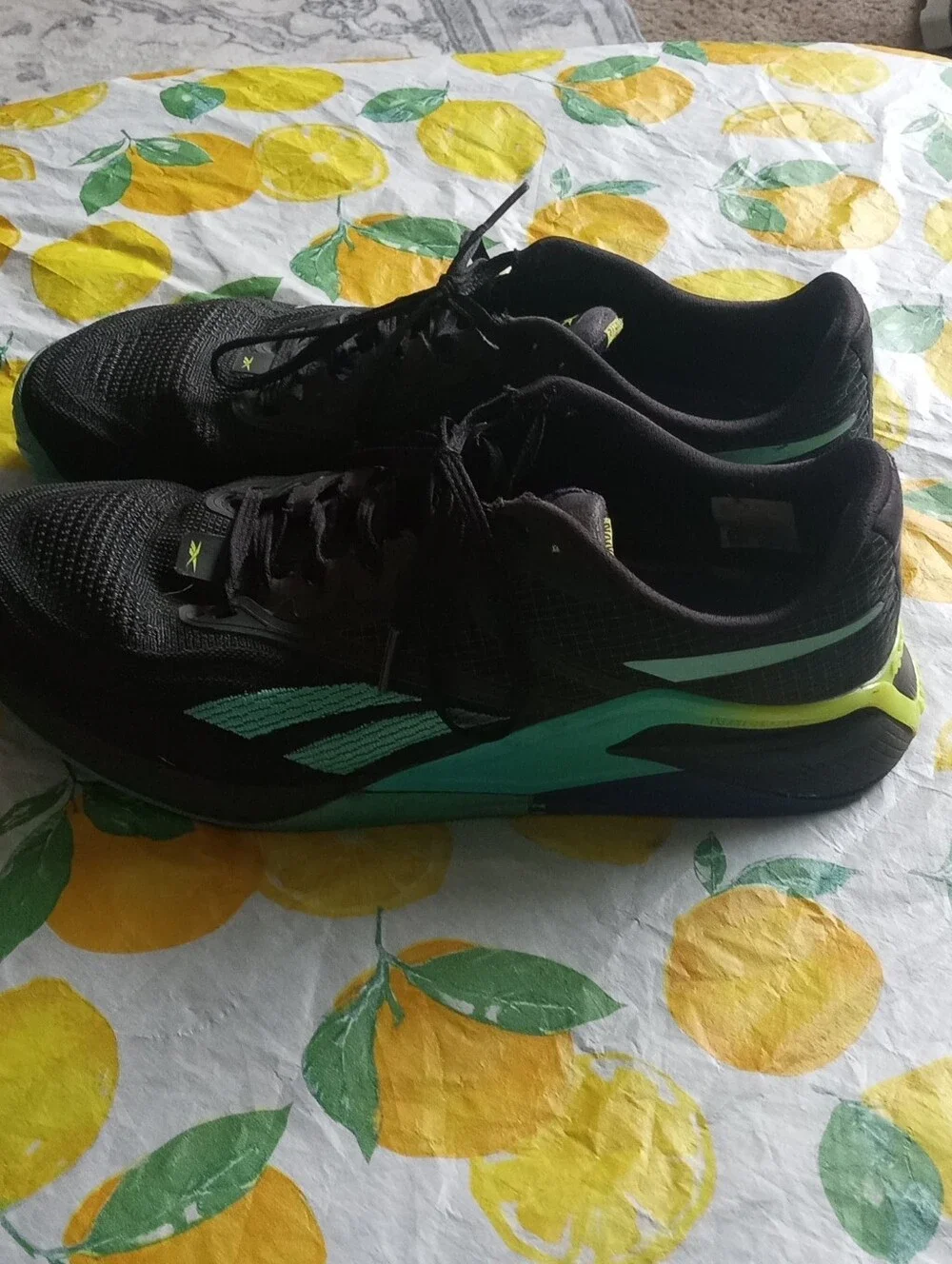 Reebok Black Sneakers with Teal Logo and Yellow Tab
